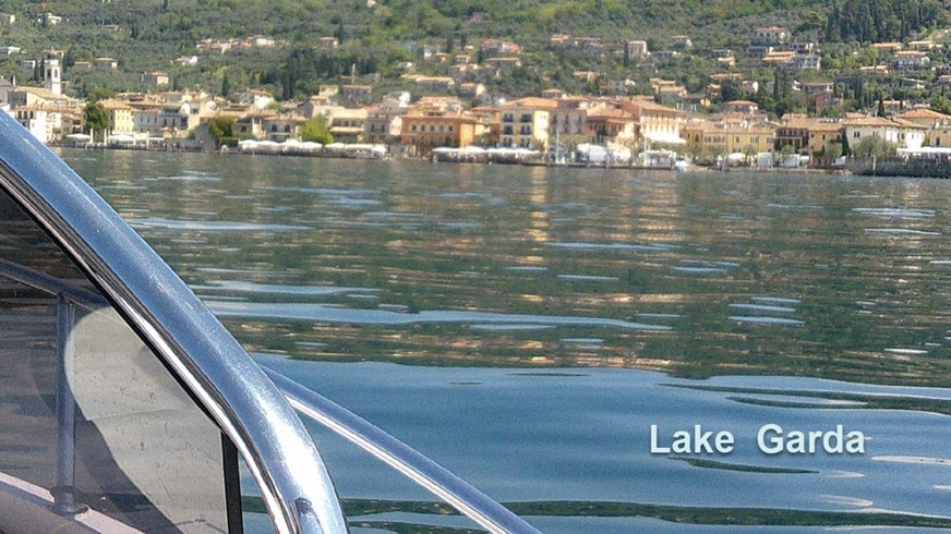 Lake Garda waterfront village from boat