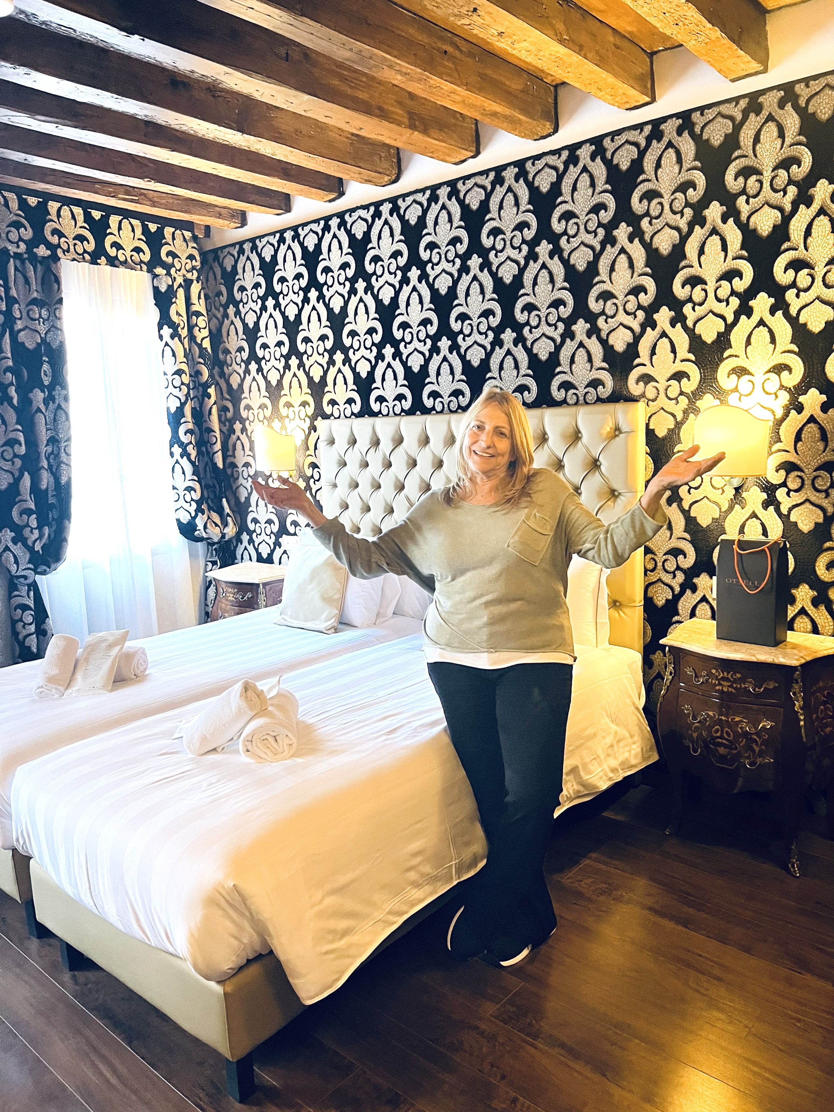 Daren posing in luxury Venice hotel bedroom