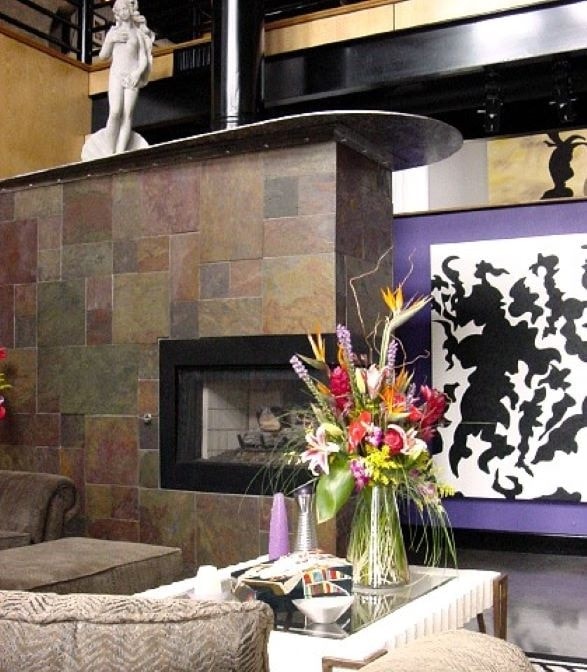 V. Les Rogers Studio — fireplace and art